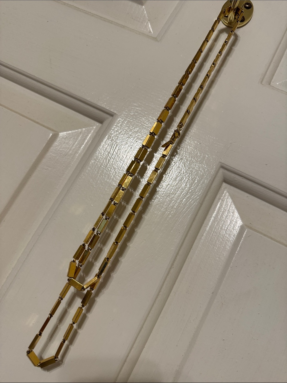 Vintage Monet brand (stamped) gold tone necklace 27”.